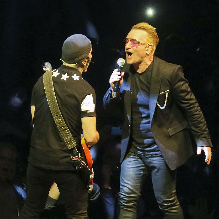 U2 bring fan on stage to perform In Gods Country Phoenix